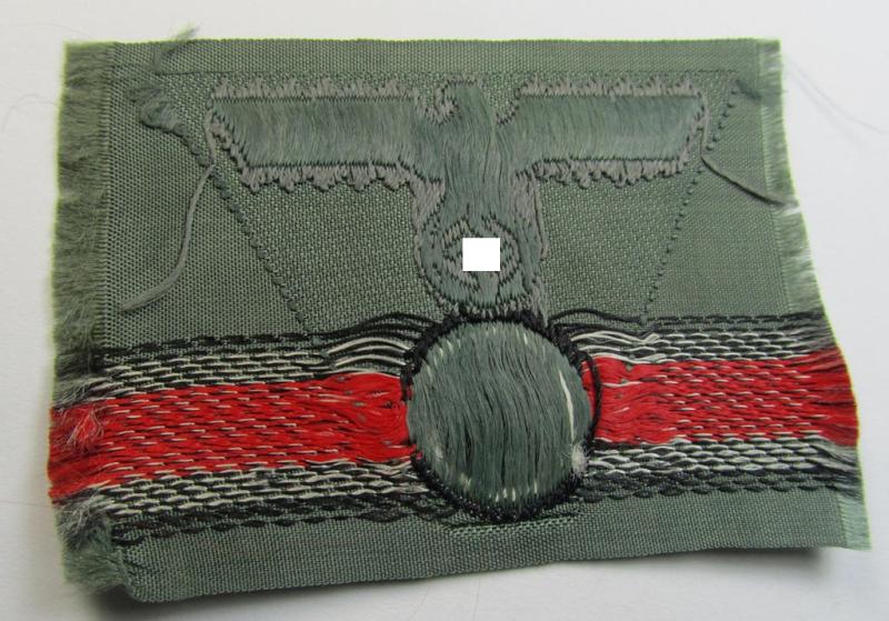 WH (Heeres) so-called: 'M43-pattern') cap-eagle/cocarde (ie. cap-trapezoid) as was specifically produced for usage on the so-called: 'M-43'-model field-caps (ie. 'Einheitsfeldmützen')