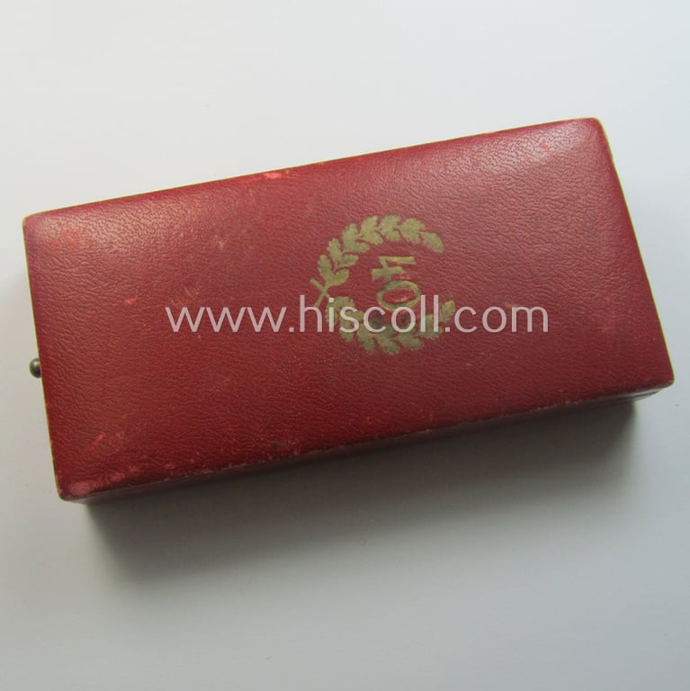 'Treuedienst Ehrenzeichen 1. Klasse' being a (typical) non-maker-marked example that came mounted onto its original ribbon (ie. 'Bandabschnitt') and that comes stored in its etui as issued