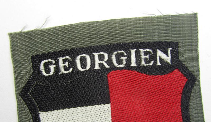 Attractive, 'BeVo'-type armshield entitled: 'Georgien' (being a 'virtually mint- ie. unissued' example as intended for a volunteer who served within the 'Deutsche Wehrmacht' ie. within the 'Georgisches Legion')