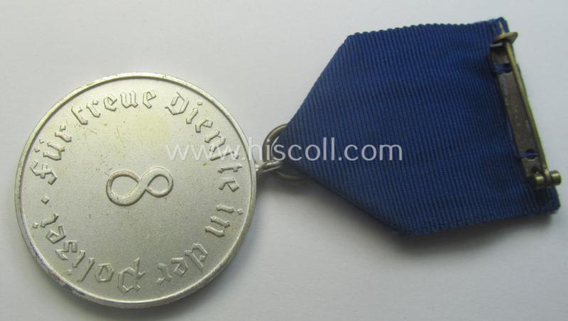 Bright-silver-toned so-called: 'Polizei-Dienstauszeichnung 3. Stufe' (or: police loyal-service medal 3rd class) that comes mounted onto its period ribbon (ie. 'Bandabschnitt')