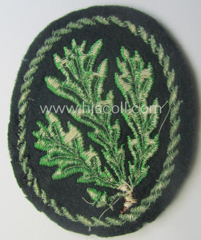 WH (Heeres) so-called: 'Jäger'-armbadge being a neatly machine-embroidered- and/or multi-coloured version as was executed on darker-green-coloured wool