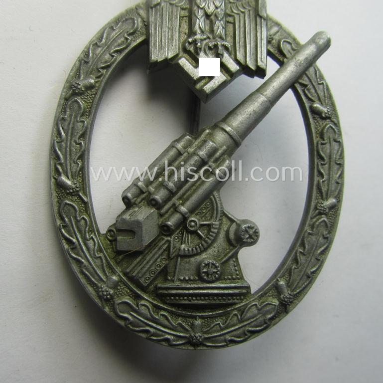 'Heeres-Flakkampf-Abzeichen' being a non-maker-marked- and/or zinc- (ie. 'Feinzink'-) based specimen of the so-called: 'pillow-crimped'-pattern (as was produced by a to date still unidentified maker)