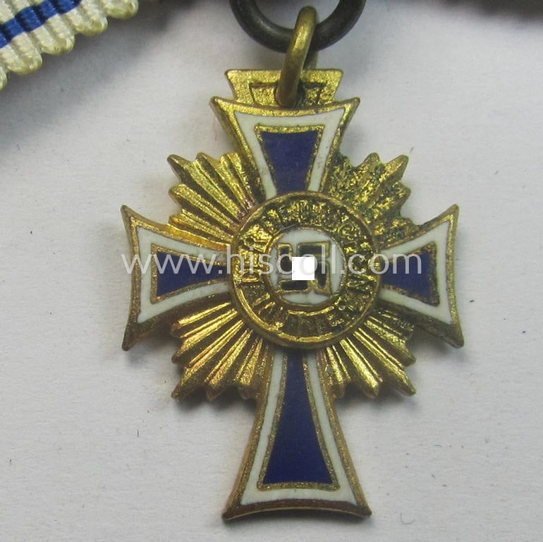 Miniature of an: 'Ehrenkreuz der deutschen Mutter - erste Stufe' (or: golden-class mothers'-cross) being a non-maker-marked example that comes in an overall nice- (albeit moderately worn- ie. used-), condition
