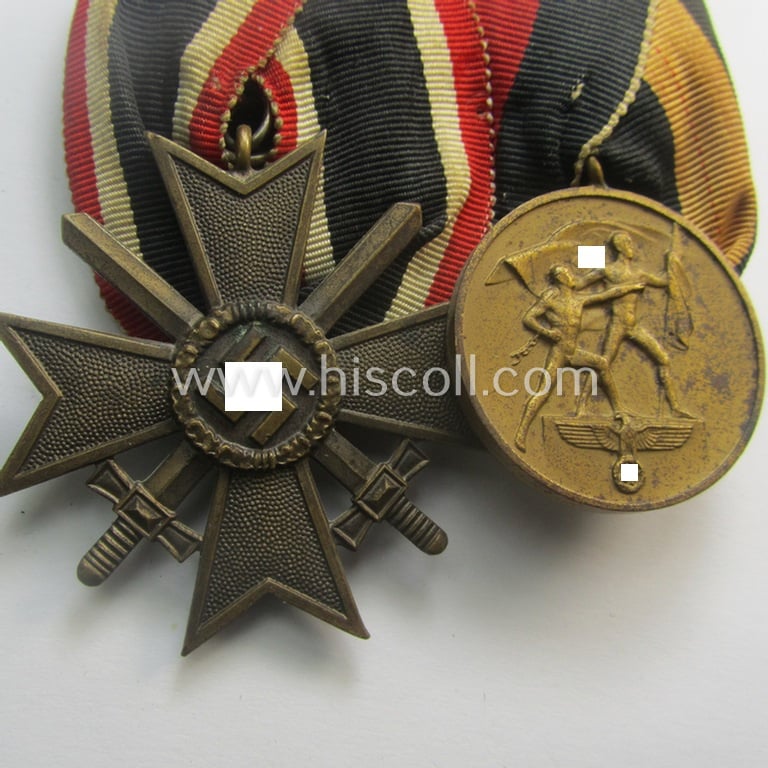 Moderately used, two-pieced medal-bar (ie.: 'Orden- o. Doppelspange') resp. showing a: 'KvK 2. Klasse mit Schw.' and a WH Czech 'Anschluss'-medal: '1. Oktober 1938'