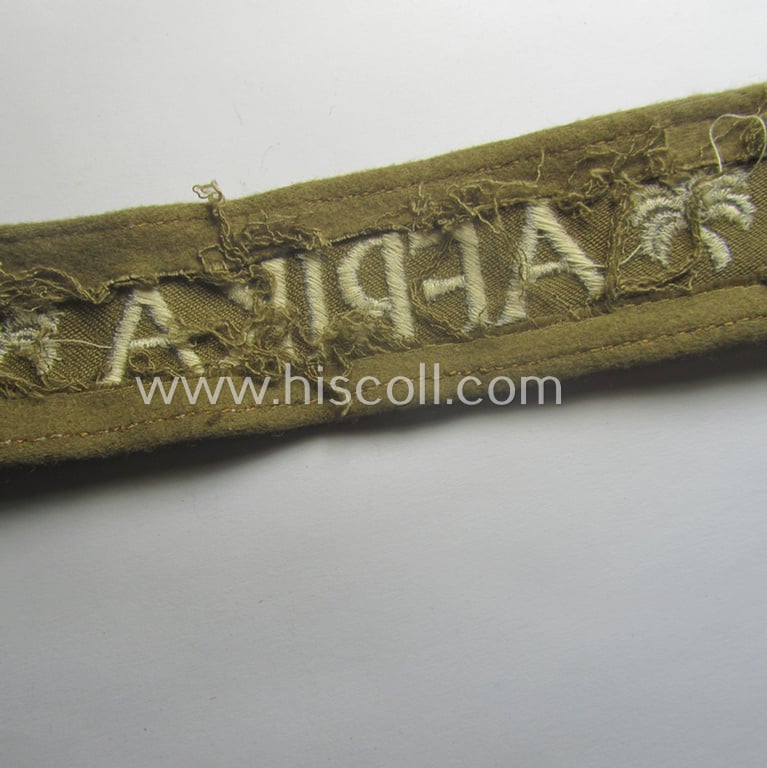 WH (LW o. Heeres) cuff-title (ie. 'Ärmelstreifen') entitled: 'Afrika' (being an example that comes in a presumably issued- albeit simply never used- ie. 'virtually mint' condition)