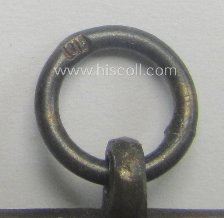 'N.S.D.A.P. Dienstauszeichnung in Bronze' (ie. '3. Stufe für 10 Jahre t. Dienste') being a clearly maker- (ie. '10'-) marked- (and 'light-weight'!) example as was produced by the maker (ie. 'Hersteller') named: 'Förster & Barth'
