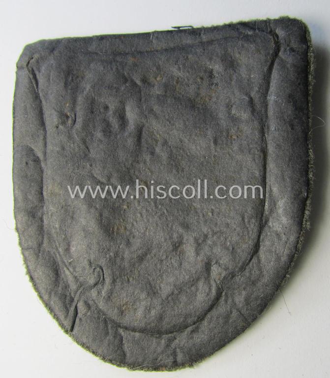 Very attractive - and actually scarcely encountered! - WH (Heeres ie. Waffen-SS) 'Kuban'-campaign-shield that comes mounted onto its original field-grey-coloured- and/or woolen-based 'backing'