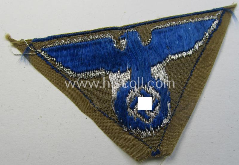 Attractive, SA-related cap-eagle as was intended for the: 'Lagermütze' (ie. side-cap) being an example as woven on a bright-blue-coloured background and as such intended for members within the: 'SA-Gruppe Warthe o. Oberrhein'