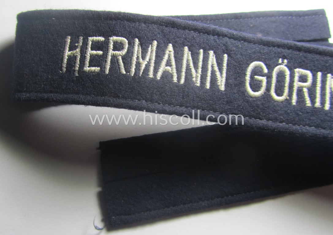 Typical 'smooth-woolen'-based, EM- (ie. NCO-) pattern WH (Luftwaffe) cuff-title (ie. 'Ärmelstreifen') entitled: 'Hermann Göring' that comes in that comes in a presumably issued- albeit (I deem) never worn, condition