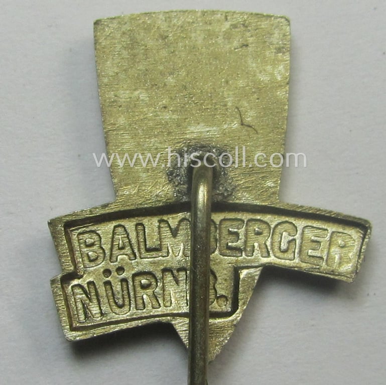 Commemorative lapel-pin (ie. 'Veranstaltungsabzeichen') being a maker- (ie. 'Balmberger-Nürnb.'-) marked example depicting a swastika-device coupled with the text: 'Deutsche Kampfspiele - Nürnberg - 1934'
