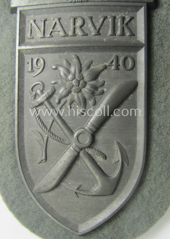 'Virtually mint' - and fully complete! - example of a WH (Heeres) 'Narvik'-campaign-shield as executed in typical: 'Feinzink' (as was presumably produced by the: 'Wilhelm Deumer'-company)