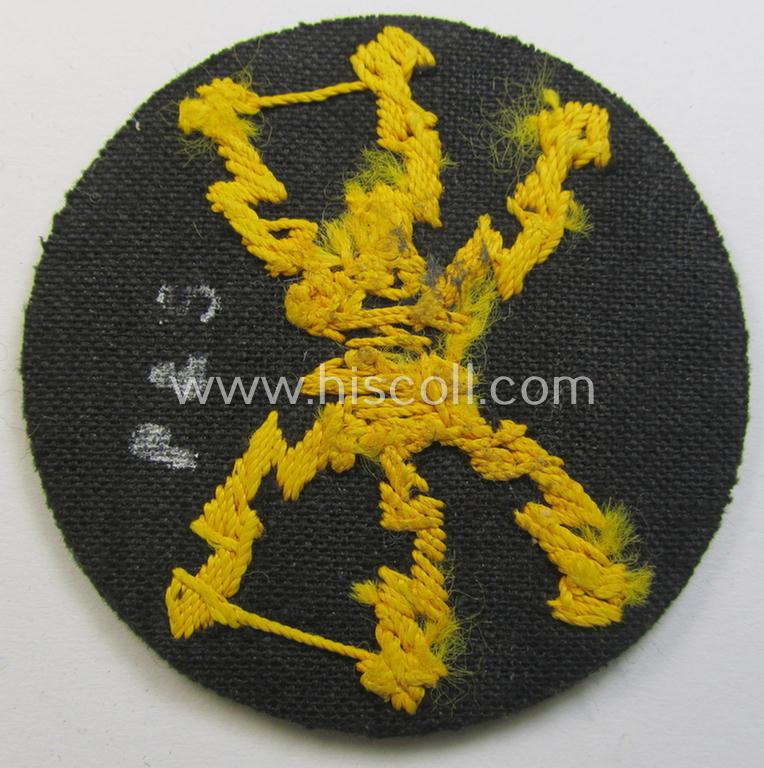 Attractive, WH (Heeres) so-called: trade- and/or special-career arm-insignia as was intended for a: 'Funkmeister' being a neatly hand-embroidered (and clearly maker-marked!) specimen on a darker-green-coloured woolen-based background