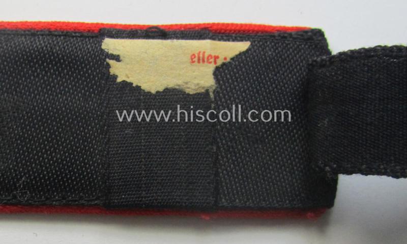 Superb - and rarely encountered! - red-piped, so-called: 'Allgemeine' HJ ('Hitlerjugend') shoulderstrap as was intended for a student who served within one of the: 'Adolf Hitler Schulen' (still having the remains of its 'RzM'-etiket attached)