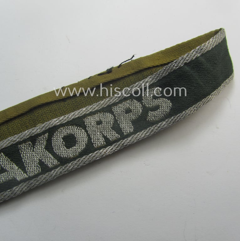 Truly worn, 'BeVo'-like cuff-title (ie. 'Ärmelstreifen') entitled: 'Afrikakorps' being a with certainty issued example that comes in an overall nice- (ie. once tunic-attached-), condition
