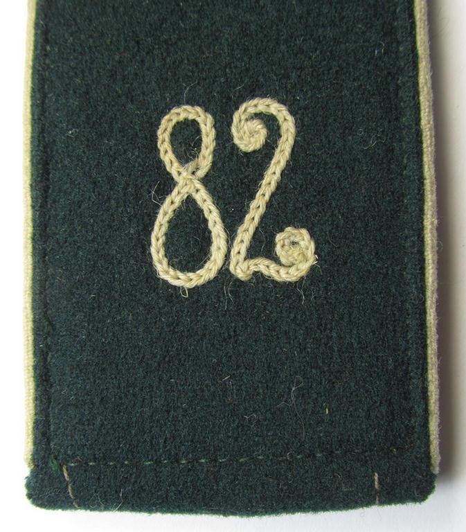 Single - and actually not that often seen! - WH (Heeres) NCO-type (ie. 'M36-/M40'-pattern- and/or: 'rounded styled-') neatly 'cyphered' shoulderstrap as was intended for usage by a: 'Soldat des Infanterie-Regiments 82'