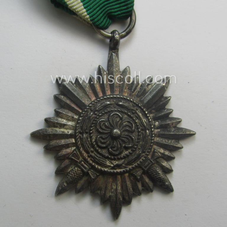 WH-related 'Tapferkeitsauszeichnung für Angehörige der Ostvölker, 2. Kl. in Silber mit Schwn.' (being a 'Feinzink'-based example that comes mounted onto its period ribbon ie. 'Bandabschnitt')