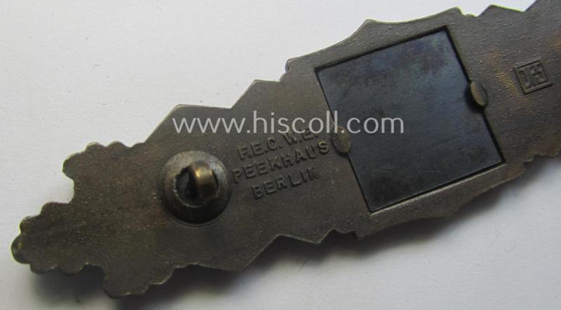 'Nahkampfspange in Bronze' (or: bronze-class close-combat clasp ie. CCC) being a neatly maker-marked- and/or minimally converse-shaped specimen as was produced by the: 'JFS'- (ie. 'Joseph Feix u. Söhne'-) company