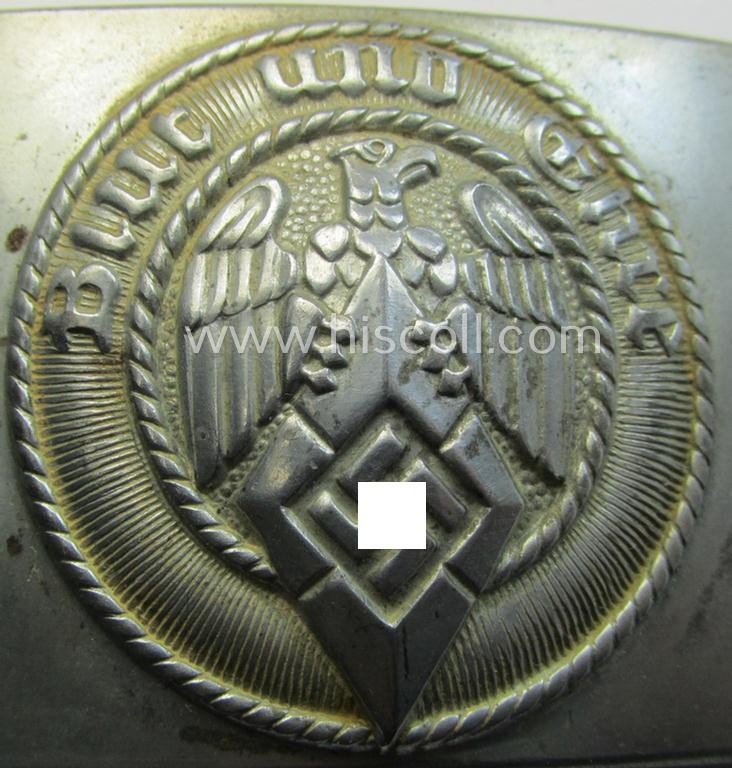 Attractive, HJ (ie. 'Hitlerjugend') silver-coloured- (ie. typically steel-based and 'crank-catch-variant'-pattern) belt-buckle being a neatly maker- (ie. 'RzM M4/42'-) marked example that comes in a just moderately used- ie. worn condition, as...