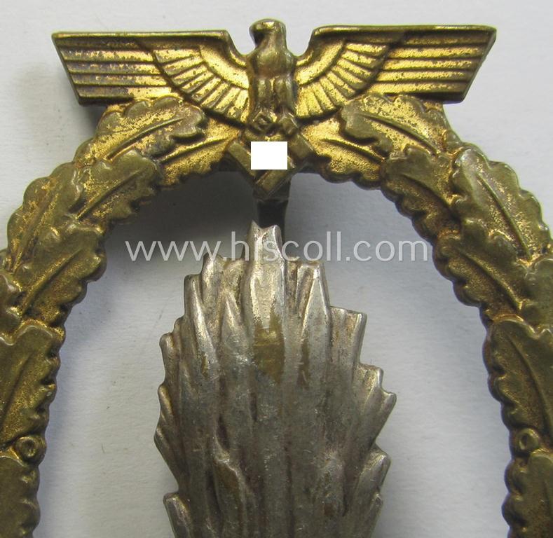 WH (Kriegsmarine) 'Kriegsabzeichen für Minensuch-, U-Boot-Jagd und Sicherungs-Verbände' (being a very detailed and clearly maker-marked example as executed in multi-coloured 'Buntmetall' as produced by the: 'Schwerin - Berlin'-company)