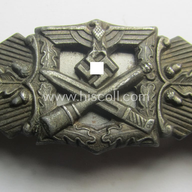 'Nahkampfspange in Bronze' (or: bronze-class close-combat clasp ie. CCC) being a (typical) maker-marked- and/or minimally converse-shaped specimen as was produced by the maker- (ie. 'Hersteller') 'Friedrich Linden' (ie. FLL)