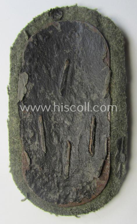 WH (Heeres ie. Waffen-SS) 'Demjansk'-campaign-shield as executed in typical magnetic metal (ie. so-called: 'Eisenblech') and that comes in an overall very nice- ie. fully untouched, condition