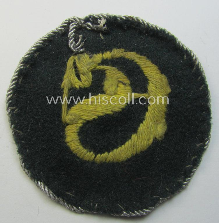 Truly used- and/or worn, WH (Heeres) machine-embroidered, trade- and/or special-career insignia (ie. 'Tätigkeitsabzeichen') as executed on a darker-green-coloured background as was intended for a: 'geprüfter Schirrmeister'