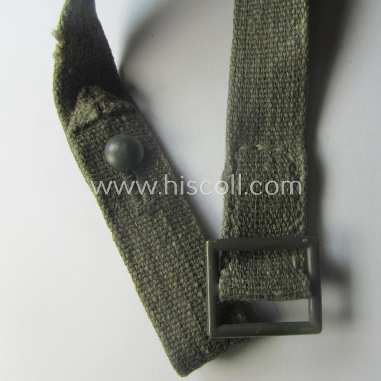 Complete, 2-pieced 'standard-issue'-pattern- (ie. typical WH-issue) carrying-strap (ie. 'Tragelasche') as was intended for the various gasmask-containers (being a maker-marked example that comes in a just minimally used, condition)