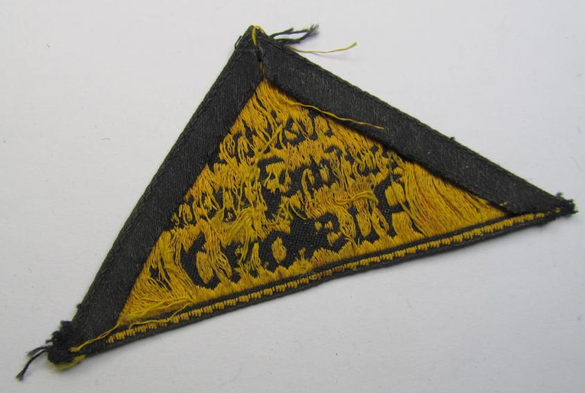 Superb - and extremely rarely encountered! - 'HJ' ('Hitlerjugend') district-triangle (ie. 'Gebietsdreieck') entitled: 'Reichs-deutsche Jugend Ausland' being a truly worn- ie. used specimen that misses its 'RzM'-etiket