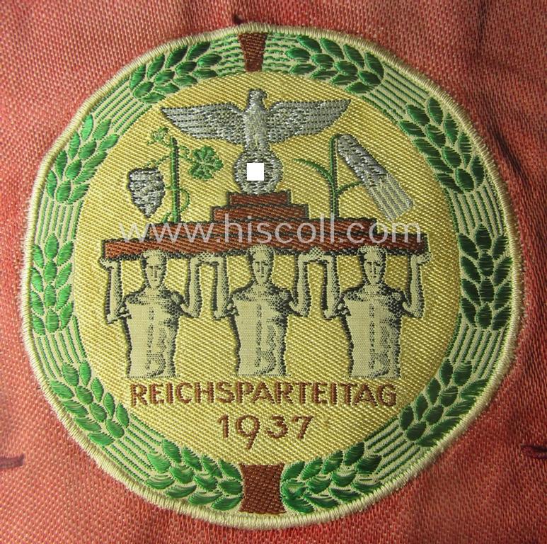 'Patriotic-styled', N.S.D.A.P.-related vehicle- ie. bicycle-flag (ie. 'Fahrrad-Fahne') depicting on one side an interwoven illustration of three men holding a statue of a 'Reichsadler'-device coupled with the text: 'Reichsparteitag 1937'