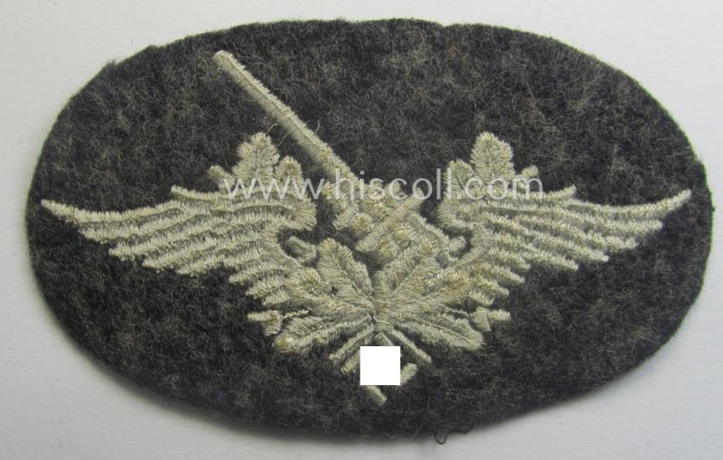 Machine-embroidered WH (Luftwaffe) trade- ie. special-career-patch as was intended for: 'Flak-Artillerie'-staffmembers and that comes in a probably issued but never worn- (ie. 'virtually mint'-), condition