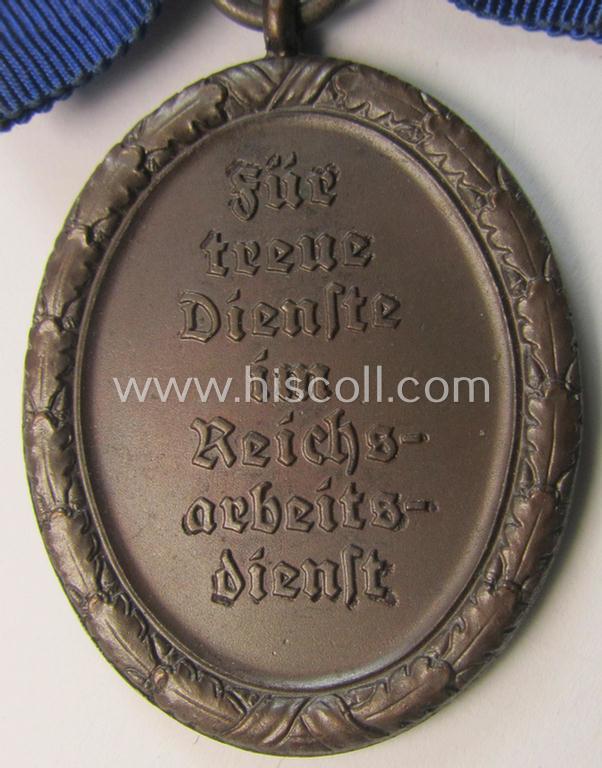 Superb example of a: 'Reichsarbeitsdienst der weiblichen Jugend' (or: RADwJ) so-called: 'Dienstauszeichnung 4. Stufe in Bronze' that comes mounted onto its period-attached ('bow-tie'-shaped!) ribbon (ie. 'Bandabschnitt')