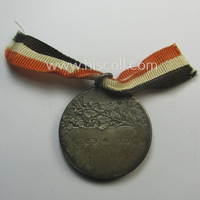 Never before seen, TR-period commemorative-medal (ie. 'Erinnerungs- o. tragbare Medaille') showing a portrait of AH and bearing on its back the engraved date: '23-4-1934' and that comes mounted onto its period ribbon (ie. 'Bandabschnitt')
