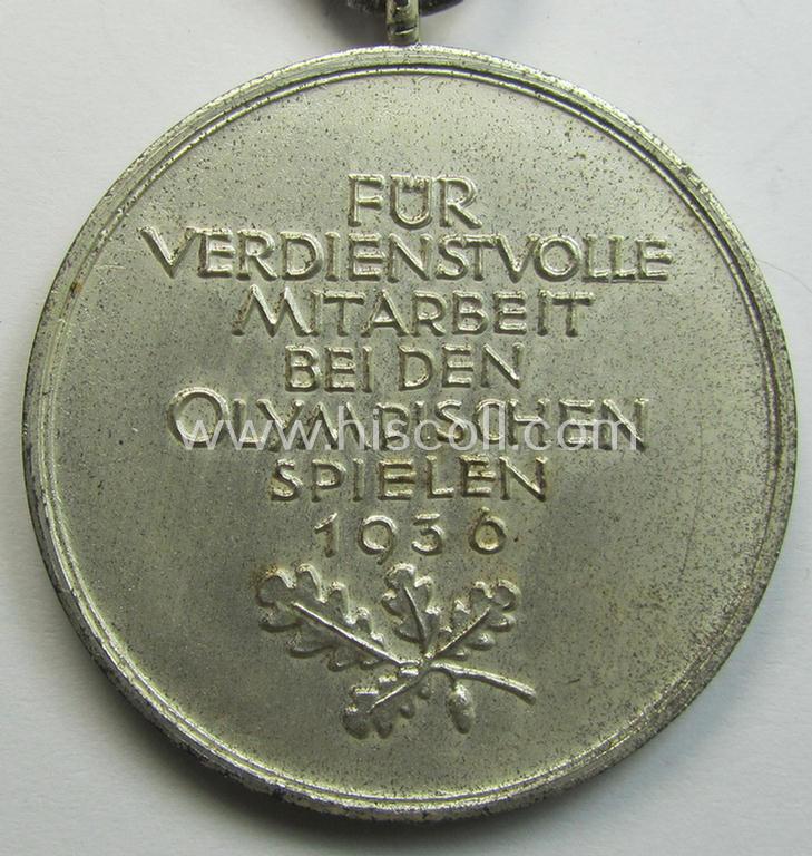 Superb, 'Deutsche Olympia-Erinnerungsmedaille 1936' being a non-maker-marked example that comes mounted onto its original ribbon (ie. 'Bandabschnitt') and that comes stored in its typical, beige-white-coloured etui as issued and stored for decade...