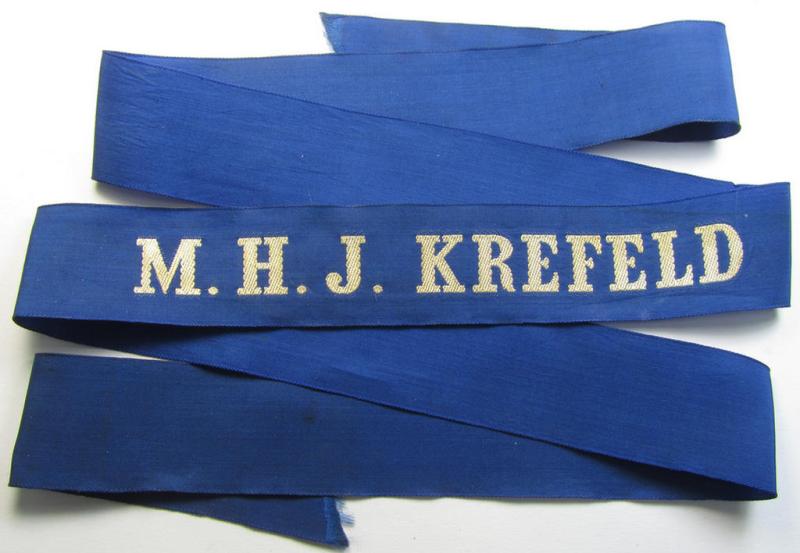 Superb - and with certainty very rarely encountered! - Marine-HJ (ie. 'Marine-Hitlerjugend') cap-tally (ie. 'Mützenband') entitled: 'M.H.J. Krefeld' (being a full-length example that comes in an overall nice condition)