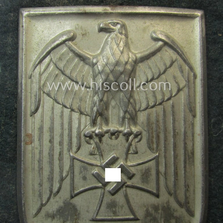 Superb - and truly rarely encountered! - WH (Heeres ie. Waffen-SS) so-called: 'Cholm'-campaign-shield as executed in magnetic, so-called: 'Eisenblech' being a 'Short M-variant-pattern' shield that comes in a clearly used- ie. worn-, condition