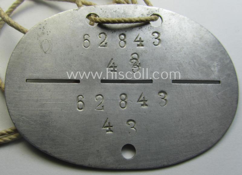 Aluminium-based, WH (LW) ie. 'Fallschirmjäger'-related ID-disc bearing the clearly stamped- and/or: 'coded'-unit- ie. 'MOB'-designation that reads: '62843' (and as such belonging to the: '2./Fsch.Jg.Rgt. 1')