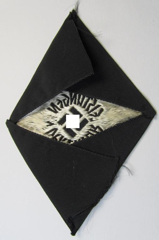 HJ/BDM- (ie. 'Hitlerjugend'/'Bund Deutscher Mädel'-) so-called: 'Leistungsabzeichen in Silber' being a cloth-based version as executed in the neat: 'BeVo'-weave pattern that comes in a never worn albeit period-folded, condition