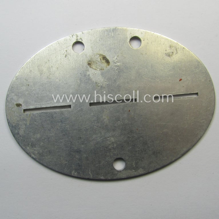 Aluminium-based, WH (Luftwaffe) ie. 'Feld-Divisionen'-related ID-disc bearing the clearly stamped unit-designation: '12./Lw.J.R. 27' (and as such belonging to the: '14. Feld-Division')