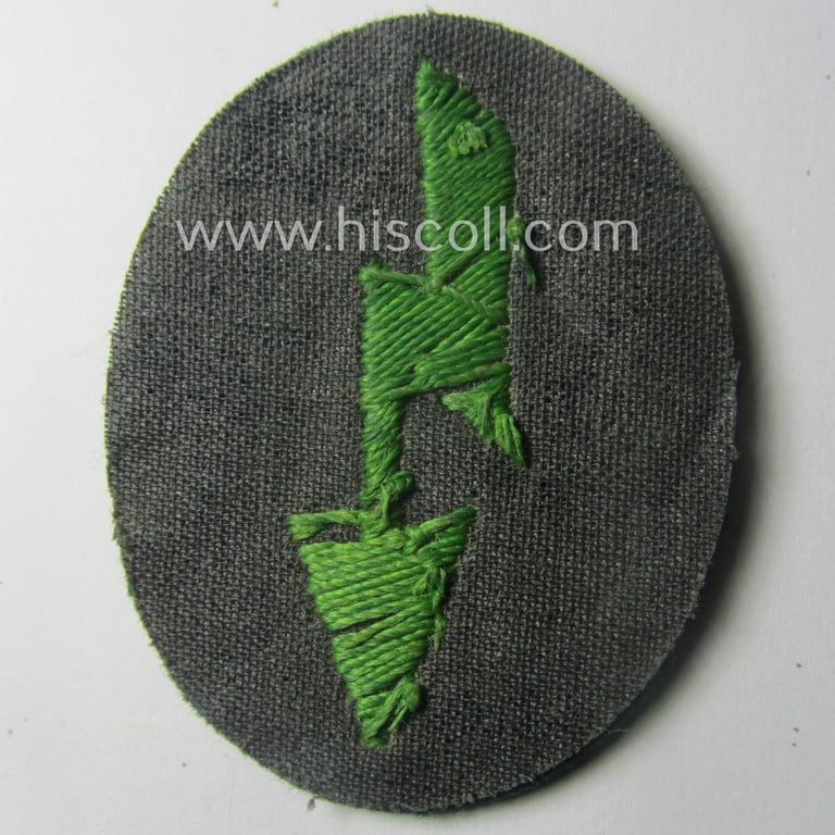 WH (Heeres) trade- and/or special-career-insignia ie. hand-embroidered 'signal-blitz' being a non-maker-marked example as executed in bright-green linnen as was specifically intended for a soldier serving within the: 'Pz.-Gren.-Trpn.'