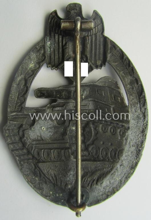 'Panzerkampf-Abzeichen in Bronze' being a 'hollow-back', non-maker-marked- (and/or: zinc- ie. 'Feinzink'-) based example as was procuced by the: 'C.E. Juncker'-company