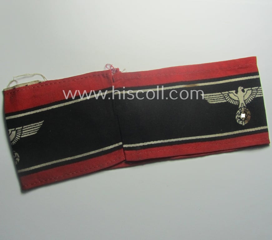 Moderately worn example of a (typically printed- and/or later-war-period) bright-red- and/or black-coloured so-called: 'Deutscher Volkssturm'-armband (ie. 'Armbinde') that comes in an overall nice condition