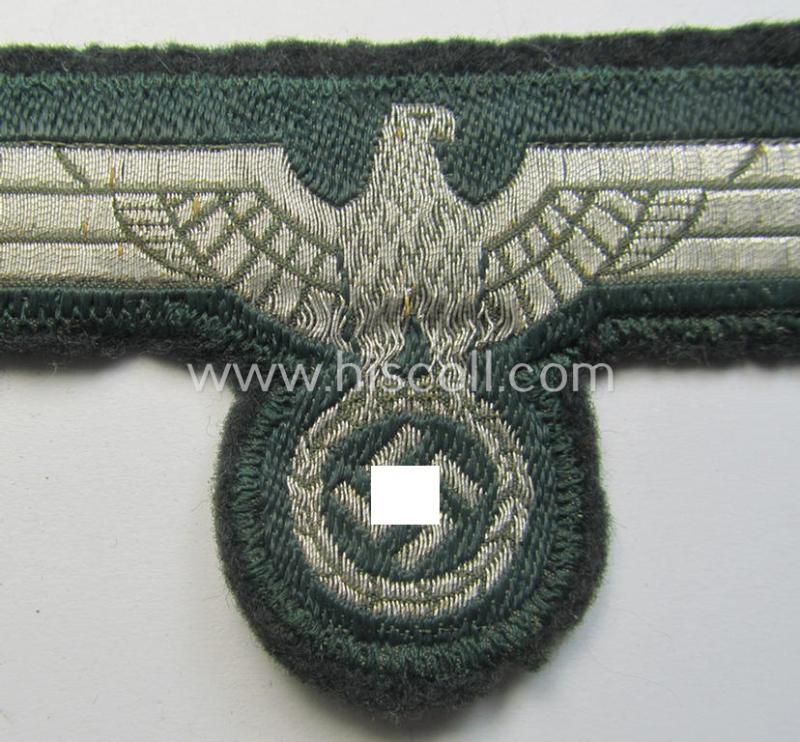 WH (Heeres) breast-eagle as executed in 'BeVo'-type-, so-called: 'flat-wire'-weave-pattern and pre-mounted on darker-green-coloured wool as was specifically intended for usage by soldiers (ie. NCOs) on their dress-tunics (ie. 'Waffenröcke')