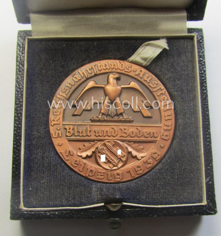 Reddish-bronze-toned, 'Reichsnährstand'- (ie. 'RNSt.'-) related, commemorative-award-plaque entitled: 'Reichsnährstands-Austellung - Blut und Boden - Leipzig 1939 - Lagerbutter' and that comes stored in its period etui