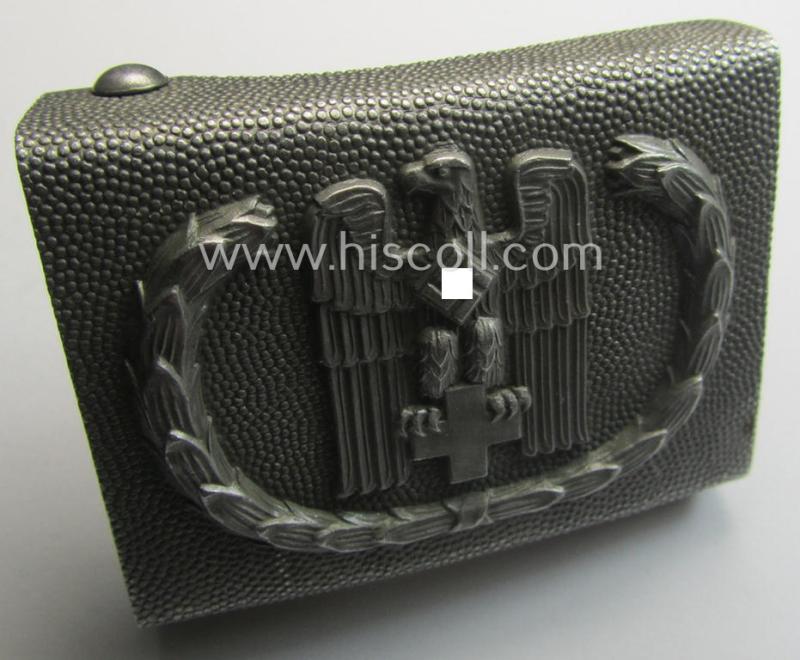 Aluminium-based, so-called: DRK (ie. 'Deutsches Rotes Kreuz'), enlisted-mens'- (ie. NCO-) type belt-buckle being a maker- (ie. 'JFS'-) marked and: 1939-dated example