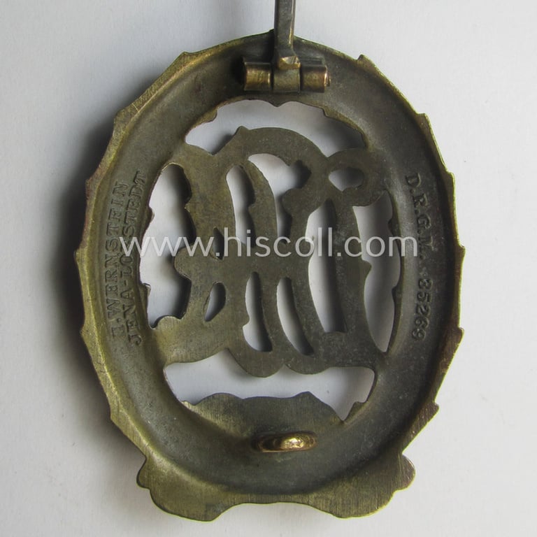 'Reichssportabzeichen DRL in Bronze' by: 'Wernstein' that came stored in its (unusally seen!) red-coloured (and maker- ie. 'Preussische Staatsmünze - Berlin'-marked pouch as issued and found