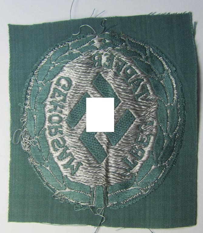 Superb - and actually rarely encountered! - officers'- (ie. evt. NCO-) type, so-called: 'Schutzmannschaften'- (ie. 'Schuma'-) armshield being executed in silver-grey-coloured 'flatwire'-thread onto a police-green-coloured background