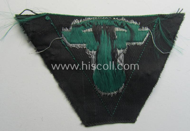 Attractive, so-called: N.S.K.K. (ie. 'National Socialistisches Kraftfahr Korps') side-cap-eagle (ie. 'Adler für N.S.K.K.-Schiffchen o. Lagermütze') being a 'flat-wire-woven'-example onto a darker-green-coloured background