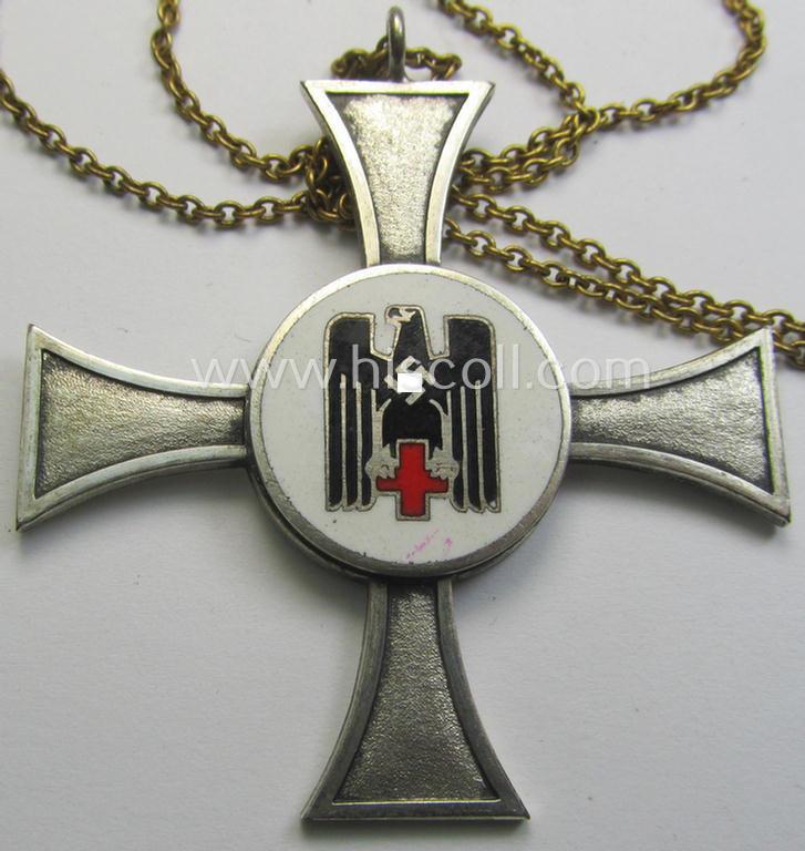 Neatly enamelled 'DRK-Schwesternkreuz des 2. Modell' that comes together with its (I deem non-period) silverish-golden-toned chain (ie. 'Kettchen') as issued and/or stored for decades