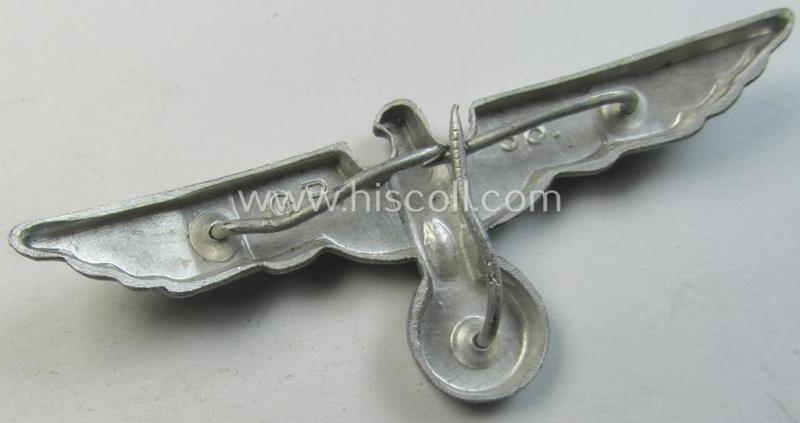 Neat, WH (Heeres) bright-silver-toned (ie. aluminium-based), EM- (ie. NCO- or officers') type visor-cap-eagle being a maker- (ie. 'G.B.'-) marked and/or: '1938'-dated example that comes in a moderately used- ie. once cap-attached-, condition