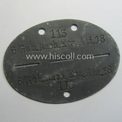 Zinc-based, WH (Heeres) 'Gebirgsjäger-Nachrichten'-related ID-disc bearing the clearly...